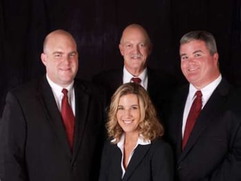 The Gendron staff, Michael Gendron, Paul Gendron, Michael Keating and Melanie Gendron (seated).