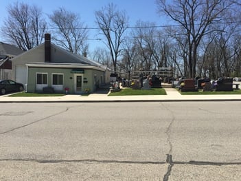 A view from across the street at Mt. Hope Cemetery in Logansport of Caldwell Monument Company-Logansport Branch